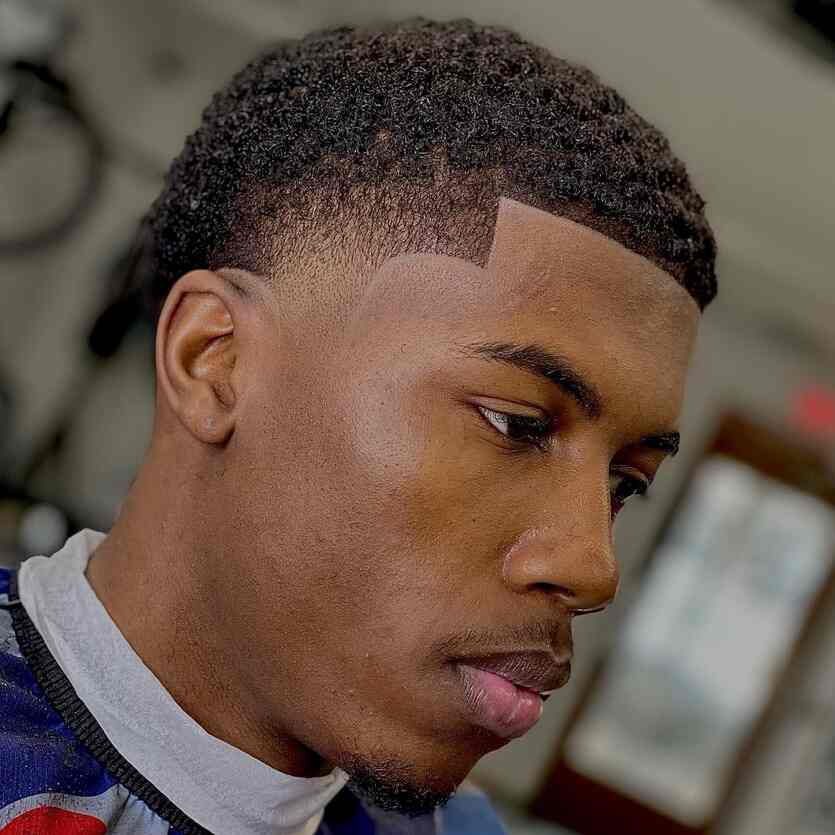 low taper fade black man 